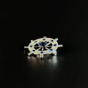Silver nautical blue crystal ship’s wheel brooch