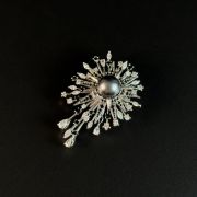 Elegant and eye-catching grey pearl sunburst brooch